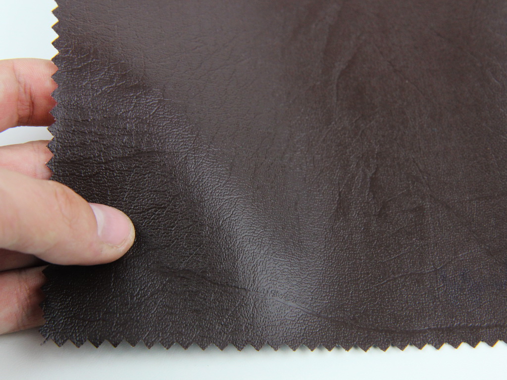 Шкірвініл меблевий гладкий (темно-коричневий Н-11) для перетяжки м'якого куточка, дивана, стільців, ширина 1.40м детальна фотка