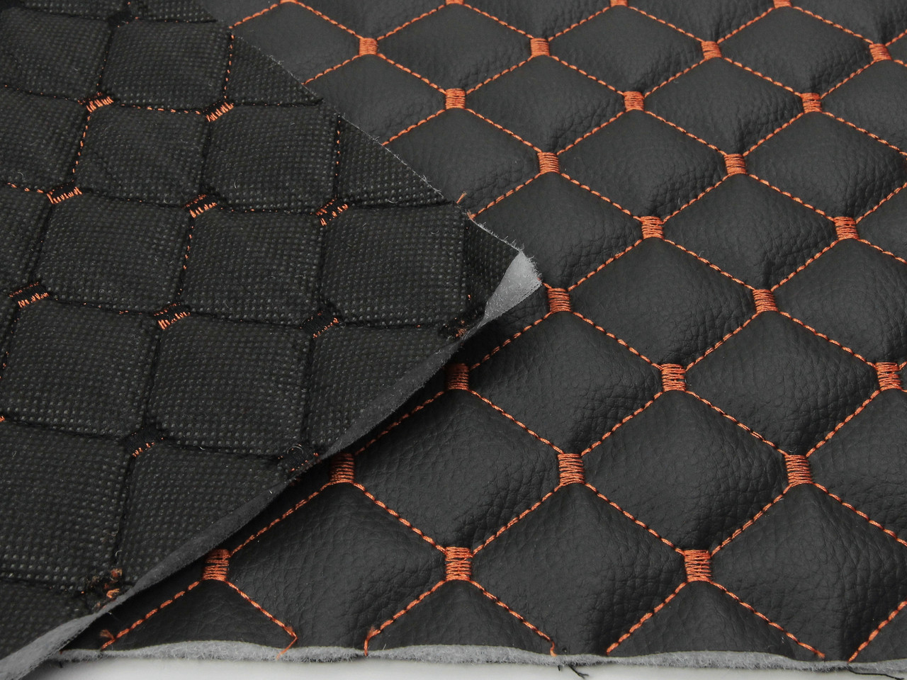 Кожзам стёганый черный «Ромб» (прошитый оранжевой нитью) дублированный синтепоном и флизелином, ширина 1,35м детальная фотка